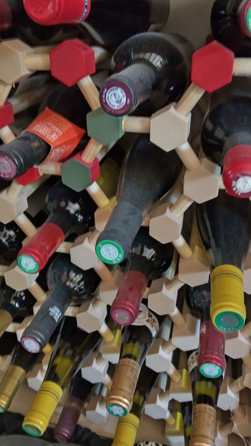 Modular 3D-printed wine rack filled with bottles
